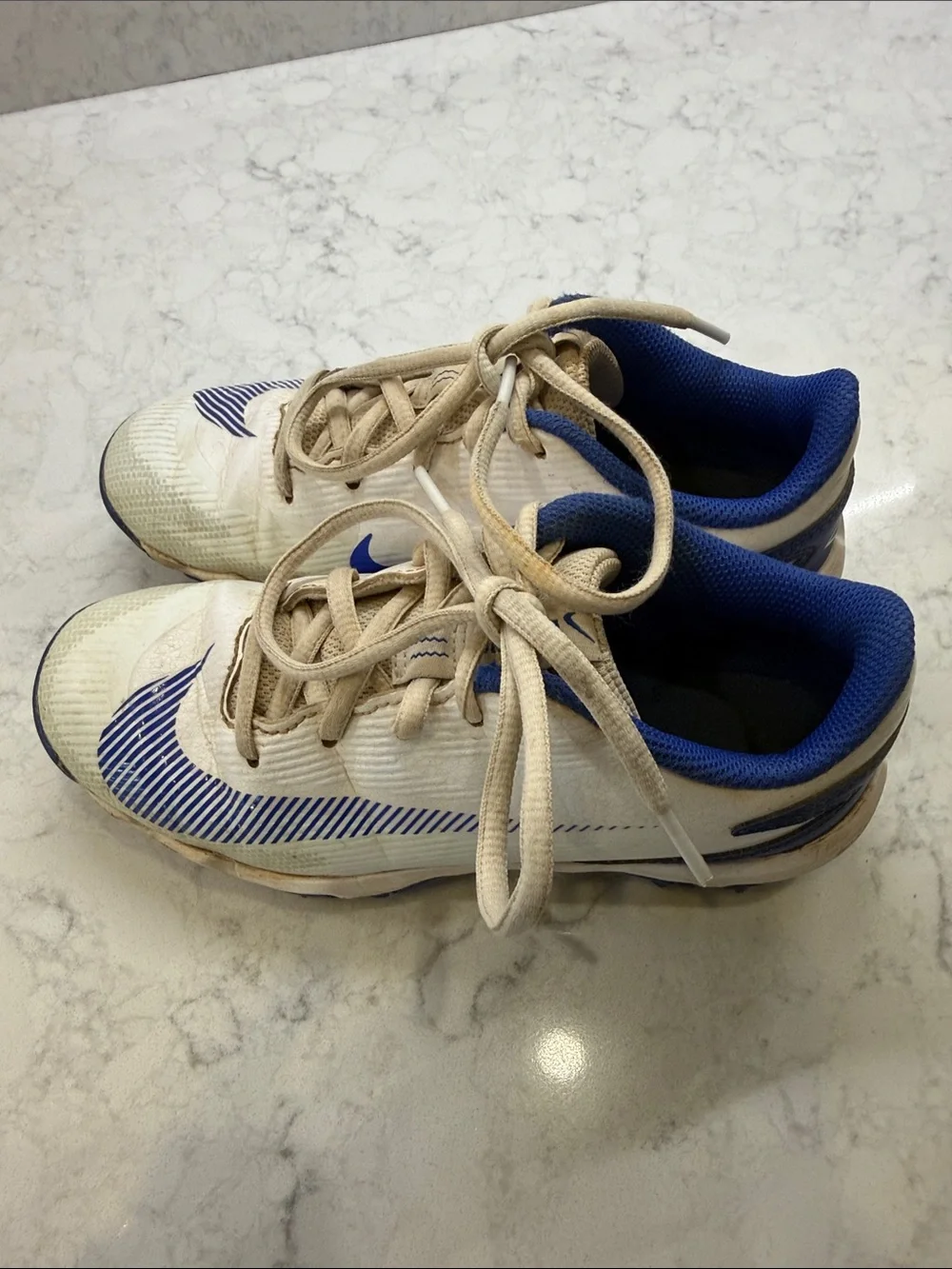 Nike Kids White and Blue Cleats, Size 2